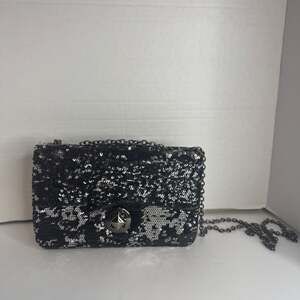 Apt. 9 This is a black and silver sequin clutch handbag